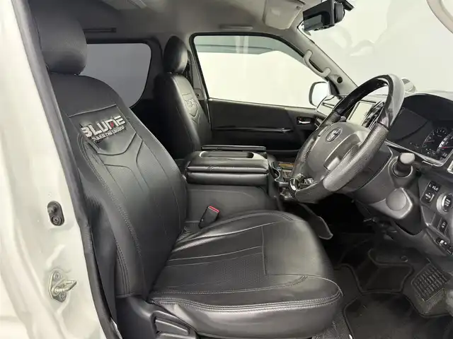 トヨタ ハイエース GL 愛知県 2016(平28)年 9.3万km ホワイトパールクリスタルシャイン 伊原工業アイシート（ベッドキット）/フロントスポイラー/リアスポイラー/リアウィング/SDナビ（AVIC-ZH0777W）/・CD/・DVD/・Bluetooth/フリップダウンモニター/パワースライドドア/レザー調シートカバー/ダズフェローズテールランプ/LEDヘッドライト/ツイーター/電動格納ミラー/プッシュスタート/ETC/フォグランプ/ミラー型レーダー探知機/フローリングマット