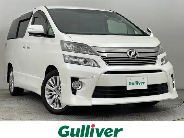 トヨタ ヴェルファイア 2．4Z 道央・札幌 2013(平25)年 4.3万km ホワイトパールクリスタルシャイン ・４WD/・禁煙車/・8インチワイド純正HDDナビ/・ALPINEフリップダウンモニター/・CD/DVD/BT/フルセグ/SD/HDD/（オーディオVTRモードでtypeCからスマートフォン接続可）/・アラウンドビューモニター/・前後ドライブレコーダー/・ビルトインETC/・社外レーダー探知機/・横滑り防止装置/・前後コーナーセンサー/・HIDヘッドライト/・フォグ/・ドアバイザー/・純正フロアマット/・純正18インチAW/・nanoe/・ecoモード/・ステアリングスイッチ/・ミラーウィンカー/・取扱説明書/・プッシュスタート/・スマートキー/・スペアキー