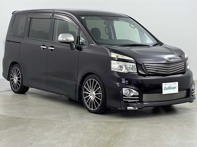 トヨタ ヴォクシー ZS 煌 道央・札幌 2011(平23)年 11.2万km ボルドーマイカメタリック ・寒冷地仕様/・純正ナビ&BT&DVD&CD/・バックカメラ/・両側パワースライドドア/・パドルシフト/・ETC/・フロントワイパーデアイサー/・ウィンカー付きドアミラー/・ドアミラーヒーター/・純正フロアマット/・社外アッパーグリル/・社外ロアビレットグリル/・HIDヘッドライト/・フォグランプ/・オートライト/・スマートキー/・スペアキー/・社外リモコンスターター/・保証書/・取扱説明書