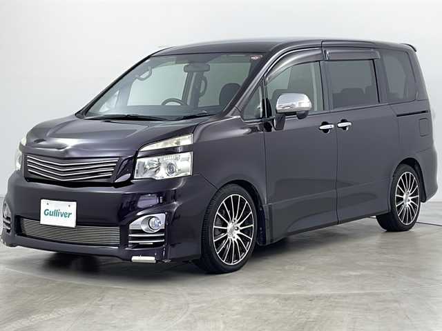 トヨタ ヴォクシー ZS 煌 道央・札幌 2011(平23)年 11.2万km ボルドーマイカメタリック ・寒冷地仕様/・純正ナビ&BT&DVD&CD/・バックカメラ/・両側パワースライドドア/・パドルシフト/・ETC/・フロントワイパーデアイサー/・ウィンカー付きドアミラー/・ドアミラーヒーター/・純正フロアマット/・社外アッパーグリル/・社外ロアビレットグリル/・HIDヘッドライト/・フォグランプ/・オートライト/・スマートキー/・スペアキー/・社外リモコンスターター/・保証書/・取扱説明書