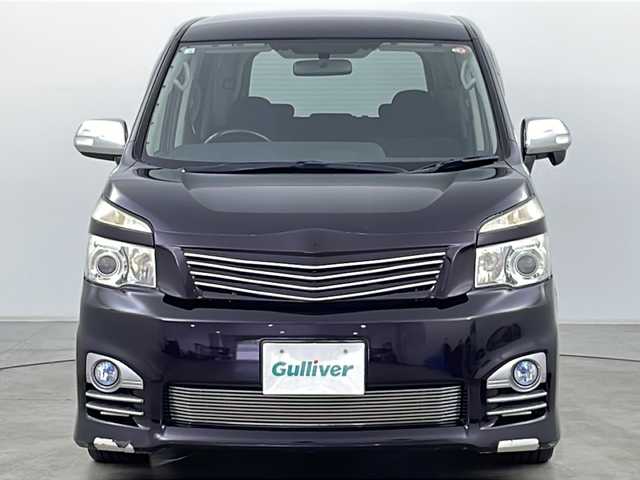 トヨタ ヴォクシー ZS 煌 道央・札幌 2011(平23)年 11.2万km ボルドーマイカメタリック ・寒冷地仕様/・純正ナビ&BT&DVD&CD/・バックカメラ/・両側パワースライドドア/・パドルシフト/・ETC/・フロントワイパーデアイサー/・ウィンカー付きドアミラー/・ドアミラーヒーター/・純正フロアマット/・社外アッパーグリル/・社外ロアビレットグリル/・HIDヘッドライト/・フォグランプ/・オートライト/・スマートキー/・スペアキー/・社外リモコンスターター/・保証書/・取扱説明書