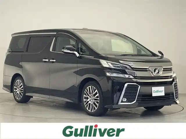 トヨタ ヴェルファイア Z Gエディション 滋賀県 2016(平28)年 7.1万km ブラック 禁煙車/ツインムーンルーフ/アルパイン11インチナビ/【Bluetooth/フルセグTV/CD/DVD】/アルパインフリップダウンモニター/バックカメラ/ビルトインETC/プリクラッシュセーフティ/クルーズコントロール/クリアランスソナー/パワーバックドア/LEDライト/ハーフレザーシート/エグゼクティブパワーシート/パワーオットマン/両側パワースライドドア/スマートキー