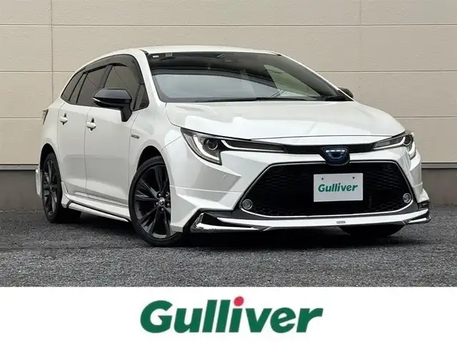 トヨタ カローラツーリング ハイブリッド ダブルバイビー 茨城県 2020(令2)年 7.3万km ホワイトパールクリスタルシャイン モデリスタフルエアロ/純正9インチディスプレイオーディオ/　(AM/FM/BT/TV)/バックカメラ/ETC/ブラインドスポットモニター/クルーズコントロール/レーンキープアシスト/前方ドライブレコーダー/ハーフレザーシート/USB接続/LEDヘッドライト/オートマチックハイビーム/スマートキー/純正フロアマット/純正17インチアルミホイール