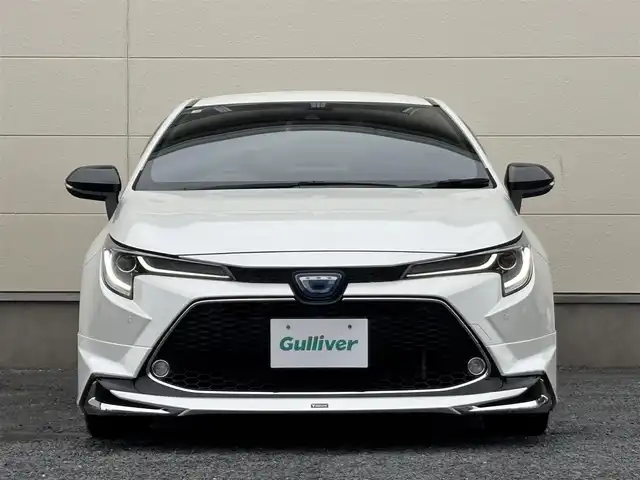 トヨタ カローラツーリング ハイブリッド ダブルバイビー 茨城県 2020(令2)年 7.3万km ホワイトパールクリスタルシャイン モデリスタフルエアロ/純正9インチディスプレイオーディオ/　(AM/FM/BT/TV)/バックカメラ/ETC/ブラインドスポットモニター/クルーズコントロール/レーンキープアシスト/前方ドライブレコーダー/ハーフレザーシート/USB接続/LEDヘッドライト/オートマチックハイビーム/スマートキー/純正フロアマット/純正17インチアルミホイール
