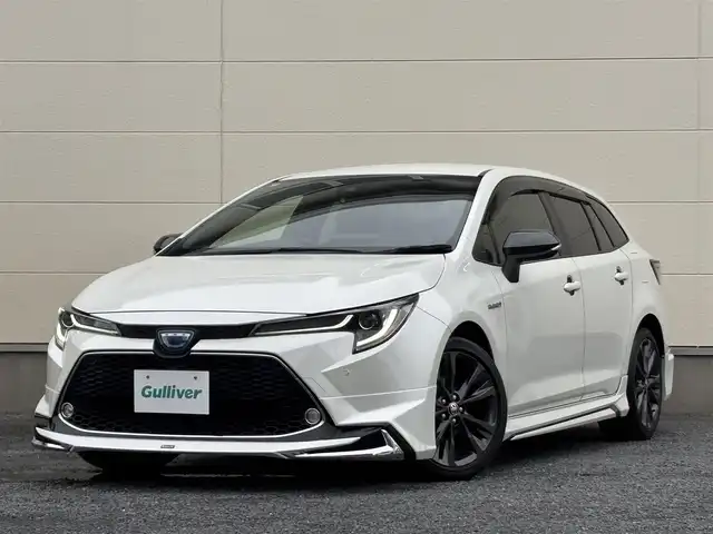 トヨタ カローラツーリング ハイブリッド ダブルバイビー 茨城県 2020(令2)年 7.3万km ホワイトパールクリスタルシャイン モデリスタフルエアロ/純正9インチディスプレイオーディオ/　(AM/FM/BT/TV)/バックカメラ/ETC/ブラインドスポットモニター/クルーズコントロール/レーンキープアシスト/前方ドライブレコーダー/ハーフレザーシート/USB接続/LEDヘッドライト/オートマチックハイビーム/スマートキー/純正フロアマット/純正17インチアルミホイール