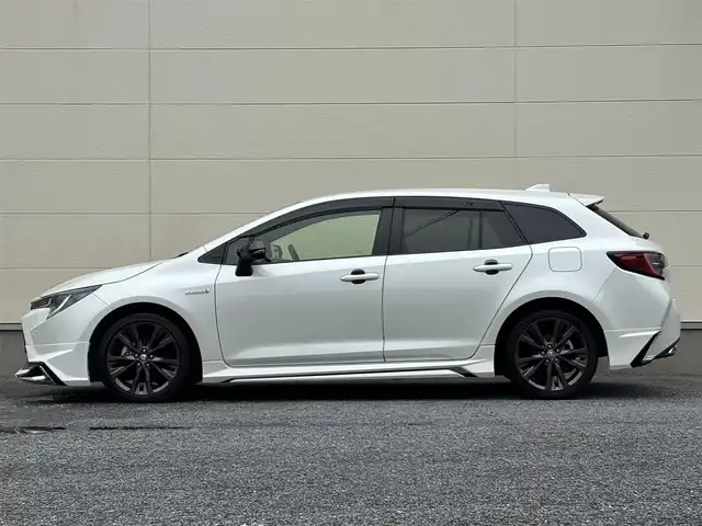 トヨタ カローラツーリング ハイブリッド ダブルバイビー 茨城県 2020(令2)年 7.3万km ホワイトパールクリスタルシャイン モデリスタフルエアロ/純正9インチディスプレイオーディオ/　(AM/FM/BT/TV)/バックカメラ/ETC/ブラインドスポットモニター/クルーズコントロール/レーンキープアシスト/前方ドライブレコーダー/ハーフレザーシート/USB接続/LEDヘッドライト/オートマチックハイビーム/スマートキー/純正フロアマット/純正17インチアルミホイール