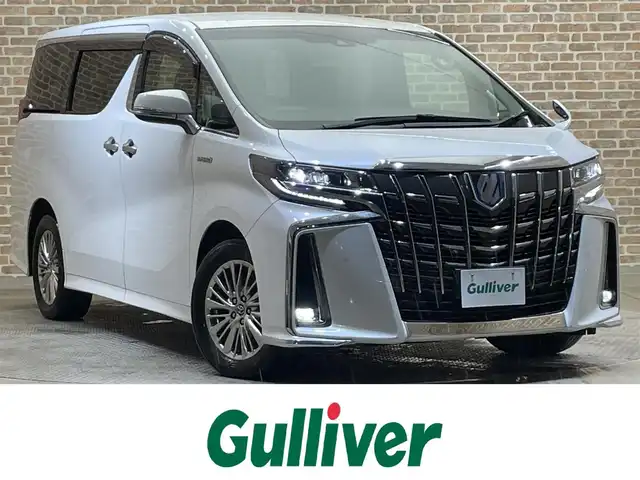 トヨタ アルファードハイブリット SR 岩手県 2018(平30)年 9.5万km ホワイトパールクリスタルシャイン 4WD/純正10型ナビ/衝突軽減システム/追従クルーズコントロール/レーンキープアシスト/ビルトインETC/純正フリップダウンモニター/純正エンジンスターター/電子パーキングブレーキ/シートヒーター/エアシート/クリアランスソナー/ドライブレコーダー/前席パワーシート/運転席シートメモリー付き/オットマン/オートライト/オートハイビーム/三眼LEDヘッドライト/フォグライト/純正17インチアルミホイール