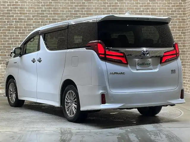 トヨタ アルファードハイブリット SR 岩手県 2018(平30)年 9.5万km ホワイトパールクリスタルシャイン 4WD/純正10型ナビ/衝突軽減システム/追従クルーズコントロール/レーンキープアシスト/ビルトインETC/純正フリップダウンモニター/純正エンジンスターター/電子パーキングブレーキ/シートヒーター/エアシート/クリアランスソナー/ドライブレコーダー/前席パワーシート/運転席シートメモリー付き/オットマン/オートライト/オートハイビーム/三眼LEDヘッドライト/フォグライト/純正17インチアルミホイール