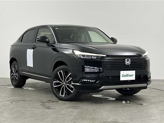 ホンダ ヴェゼル ハイブリッド e:HEV Z 三重県 2025(令7)年 0.1万km未満 クリスタルブラックパール 登録済未使用車/Honda CONNECTディスプレー＋ETC2.0車載器/・フルセグ・Bluetooth・USB・AppleCarPlay・AndroidAuto/バックカメラ/パワーバックドア/ステアリングヒーター/前席シートヒーター/ステアリングヒーター/電動パーキング/パドルシフト/HondaSENSING/・衝突軽減ブレーキ/・誤発進抑制機能/・後方誤発進抑制機能/・渋滞追従機能付アダプティブクルーズコントロール/・車線維持支援システム/・先行車発進お知らせ機能/・オートハイビーム/・パーキングセンサーシステム