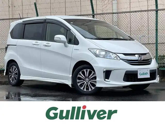 ホンダ フリード ハイブリット ジャストセレクション 東京都 2015(平27)年 8万km ホワイトオーキッドパール 純正ナビ/バックモニター/クルーズコントロール/両側電動スライドドア/横滑り防止措置/ECOモード/ステアリングスイッチ/オートエアコン/キーレスエントリー/シフトレバー/オートウィンドウ