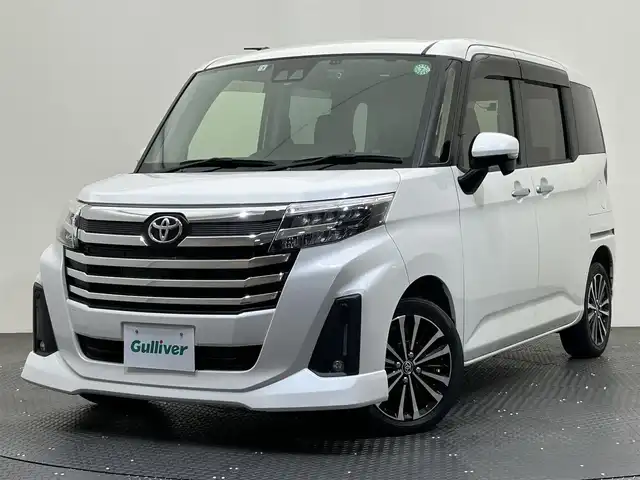 トヨタ ルーミー カスタムG－T 愛媛県 2022(令4)年 3.3万km パールホワイトⅢ ・９型ナビ（フルセグＴＶ・ＢＴ・ＣＤ・ＤＶＤ・ＦＭ・ＡＭ・ＳＤ）/・バックカメラ　/・ＥＴＣ２．０　/・前後ドラレコ　/・両側電動ドア　/・レーダークルコン　/・レーンキープ　/・ＤＮ席シートヒーター　/・ＵＳＢ電源　/・置くだけ充電/・衝突軽減ブレーキ/・オートマチックハイビーム