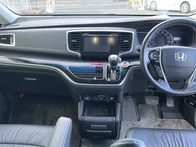 ホンダ オデッセイ ハイブリッド 福島県 2017(平29)年 8.5万km ホワイトオーキッドパール 純正ナビ　/(CD/DVD/BT/フルセグTV)/HDMI/純正フリップダウンモニター/全周囲カメラ/バックカメラ/両側パワースライドドア/クルーズコントロール追従あり/ホンダセンシング/前方ドライブレコーダー/Ｄ席パワーシート/Ｄ席Ｎ席シートヒーター/レザーシート/ビルトインＥＴＣ/純正17インチアルミホイール/LEDヘッドライト