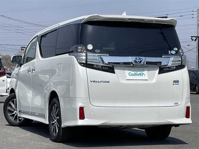 トヨタ ヴェルファイア ハイブリット ZR Gエディション 道央・札幌 2015(平27)年 7.2万km ホワイトパールクリスタルシャイン ４WD/寒冷地仕様/JBLプレミアムサウンドシステム/純正ディーラーOPナビ/CD/DVD/BT/フルセグ/純正フリップダウンモニター/プリクラッシュセーフティ/横滑り防止装置/レーダークルーズコントロール/クリアランスソナー/アラウンドビューモニター/ビルトインETC/ドライブレコーダー/EVMODE/ECOMODE/自動防眩ミラー/両側パワースライドドア/パワーバックドア/前席/２列目パワーシート/前席シートヒーター/D席メモリーシート/N席/２列目オットマン/レザーシート/革巻きステアリング/ステアリングリモコン/ハンドルヒーター/AC100V/電動パーキング/ブレーキホールド/レーダー探知機/MTモード付AT/プッシュスタート/スマートキー/LEDヘッドライト/オートライト/オートハイビーム/フォグランプ/電動格納ミラー/ウィンカーミラー/純正ラバーフロアマット/スペアキー