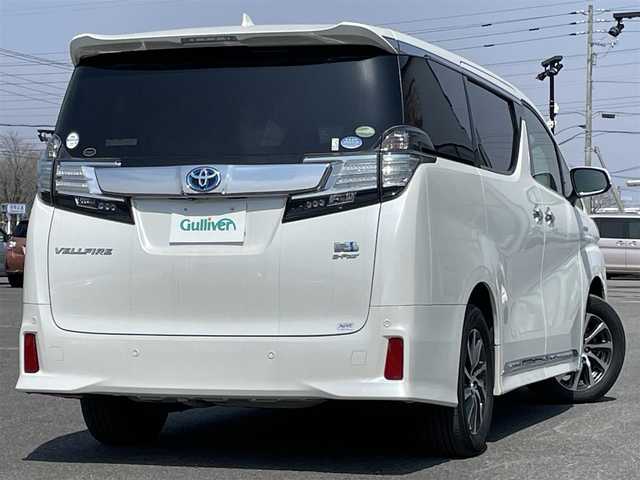 トヨタ ヴェルファイア ハイブリット ZR Gエディション 道央・札幌 2015(平27)年 7.2万km ホワイトパールクリスタルシャイン ４WD/寒冷地仕様/JBLプレミアムサウンドシステム/純正ディーラーOPナビ/CD/DVD/BT/フルセグ/純正フリップダウンモニター/プリクラッシュセーフティ/横滑り防止装置/レーダークルーズコントロール/クリアランスソナー/アラウンドビューモニター/ビルトインETC/ドライブレコーダー/EVMODE/ECOMODE/自動防眩ミラー/両側パワースライドドア/パワーバックドア/前席/２列目パワーシート/前席シートヒーター/D席メモリーシート/N席/２列目オットマン/レザーシート/革巻きステアリング/ステアリングリモコン/ハンドルヒーター/AC100V/電動パーキング/ブレーキホールド/レーダー探知機/MTモード付AT/プッシュスタート/スマートキー/LEDヘッドライト/オートライト/オートハイビーム/フォグランプ/電動格納ミラー/ウィンカーミラー/純正ラバーフロアマット/スペアキー