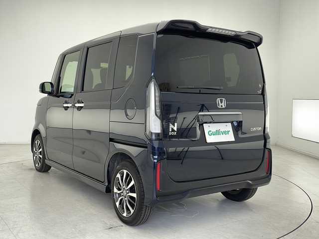 ホンダ Ｎ ＢＯＸ カスタム 千葉県 2024(令6)年 0.1万km ミッドナイトブルービームM ディスプレイオーディオ/Bluetooth AM FM AppleCarPlay AndoroidAuto/バックカメラ/両側パワースライドドア/シートヒーター/電動パーキングブレーキ/純正アルミホイール/純正フロアマット/ベンチシート/チップアップシート/後席サンシェード/プッシュスタート/スマートキー/ウィンカーミラー/ステアリングスイッチ/ホンダセンシング/レーダークルーズコントロール/オートハイビーム/パーキングセンサー/路外逸脱抑制機能/衝突軽減ブレーキ/踏み間違い衝突軽減ブレーキ/先行者発進告知/標識認識機能