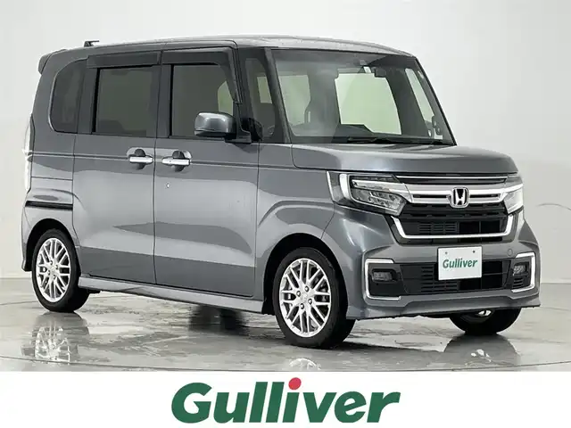 ホンダ Ｎ ＢＯＸ カスタム L ターボ 滋賀県 2021(令3)年 2.4万km シャイニンググレーM 社外ナビ/・フルセグTV・Bluetooth・CD・DVD/バックカメラ/ETC/前方ドライブレコーダー/両側パワースライドドア/運転席シートヒーター/コーナーセンサー/追従クルーズコントロール/レーンキープアシスト/横滑り防止機能/衝突軽減機能/オートライト/スマートキー/スペアキー/ステアリングスイッチ