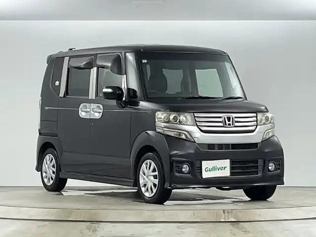 ホンダ Ｎ ＢＯＸ カスタム G Lパッケージ 愛知県 2013(平25)年 10.5万km プレミアムゴールドパープルパール ディーラーOPナビ（AM/FM/ワンセグ/BT/CD/DVD）/バックカメラ/両側パワースライドドア/プッシュスタート/スマートキー/オートライト/電格ミラー/社外シートカバー/ステアリングスイッチ/純正ホイールキャップ/ドアバイザー/ETC/横滑り防止機能/アイドリングストップ/フォグランプ