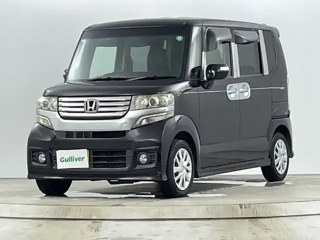 ホンダ Ｎ ＢＯＸ カスタム G Lパッケージ 愛知県 2013(平25)年 10.5万km プレミアムゴールドパープルパール ディーラーOPナビ（AM/FM/ワンセグ/BT/CD/DVD）/バックカメラ/両側パワースライドドア/プッシュスタート/スマートキー/オートライト/電格ミラー/社外シートカバー/ステアリングスイッチ/純正ホイールキャップ/ドアバイザー/ETC/横滑り防止機能/アイドリングストップ/フォグランプ