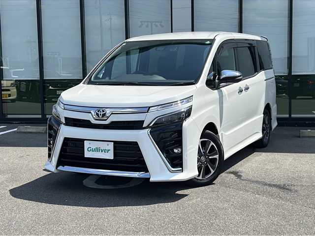 トヨタ ヴォクシー ZS 煌Ⅲ 岐阜県 2020(令2)年 5.1万km ホワイトパールクリスタルシャイン 登録時走行距離50126km/純正９型ナビ　/フルセグ　/バックカメラ　/両側パワースライドドア　/プリクラッシュセーフティ　/クルーズコントロール　/前後コーナーセンサー　/前後ドライブレコーダー　/ＬＥＤヘッドライト　/オートライト/オートハイビーム/ビルトインＥＴＣ　/スマートキー/プッシュスタート/ドアバイザー/ウィンカーミラー/背面テーブル/純正16インチアルミホイール/純正フロアマット
