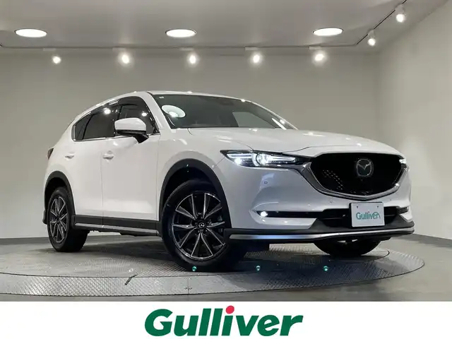 マツダ ＣＸ－５ XD Lパッケージ 愛知県 2019(平31)年 7万km スノーフレイクホワイトパールマイカ 純正８インチナビ/ＢＯＳＥサウンドシステム/３６０°ビューモニター/パワーバックドア/レーダークルーズコントロール/衝突軽減ブレーキ/ブラインドスポットモニター/クリアランスソナー/レーンキープアシスト/ヘッドアップディスプレイ/電動パーキングブレーキ/ブレーキホールド/ホワイトレザーシート/パワーシート【シートメモリー機能付】/ハンドルヒーター/シートヒーター/デジタルインナーミラー/前後ドライブレコーダー/ＥＴＣ/USB＆AUX入力端子/ISOFIX/LEDヘッドライト/純正フロアマット/純正19インチアルミホイール