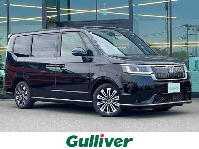 ホンダ ステップワゴン スパーダ eHEV プレミアムライン 東京都 2025(令7)年 0.5万km クリスタルブラックパール HondaSENSING/（安全運転支援システム）/・衝突軽減ブレーキ/・渋滞追従機能付アダプティブクルーズコントロール/・歩行者事故低減ステアリング/・車線維持支援システム/・先行車発進お知らせ機能/・オートハイビーム/・標識認識機能/純正9インチナビ/マルチビューモニター/パワーバックドア/両側パワースライドドア/アダプティブLEDヘッドライト/ブラインドスポットモニター/ 後退時ブレーキサポート/全列USBチャージ/トリプルゾーンコントロール/２列目キャプテンシート