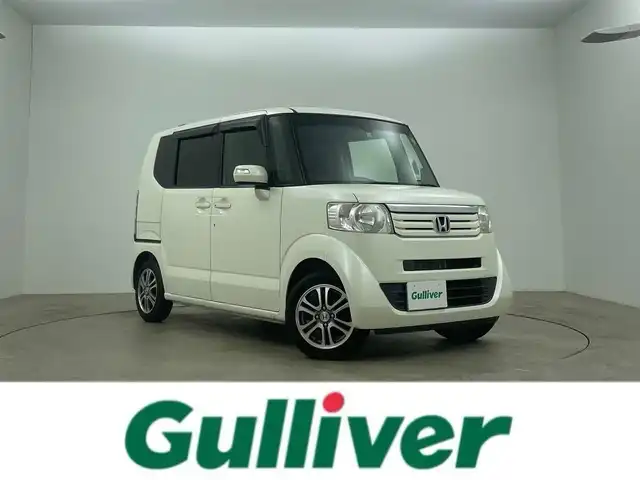 ホンダ Ｎ ＢＯＸ SSパッケージ 岡山県 2015(平27)年 7万km プレミアムホワイトパール 純正7インチナビ/バックカメラ/FM/AM/Bluetooth/フルセグ/CD/DVD/あんしんパッケージ/シティブレーキアクティブシステム/前席用i-サイドエアバッグシステム/サイドカーテンエアバッグシステム/両側パワースライドドア/ETC/純正14インチアルミホイール/純正フロアマット