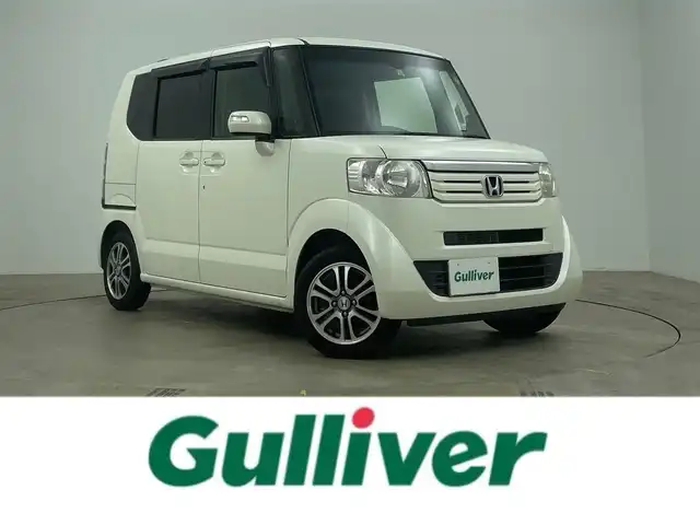 ホンダ Ｎ ＢＯＸ SSパッケージ 岡山県 2015(平27)年 7万km プレミアムホワイトパール 純正7インチナビ/バックカメラ/FM/AM/Bluetooth/フルセグ/CD/DVD/あんしんパッケージ/シティブレーキアクティブシステム/前席用i-サイドエアバッグシステム/サイドカーテンエアバッグシステム/両側パワースライドドア/ETC/純正14インチアルミホイール/純正フロアマット
