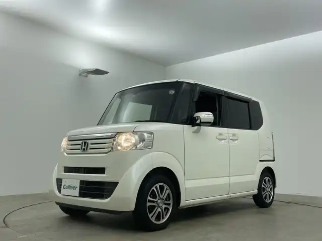 ホンダ Ｎ ＢＯＸ SSパッケージ 岡山県 2015(平27)年 7万km プレミアムホワイトパール 純正7インチナビ/バックカメラ/FM/AM/Bluetooth/フルセグ/CD/DVD/あんしんパッケージ/シティブレーキアクティブシステム/前席用i-サイドエアバッグシステム/サイドカーテンエアバッグシステム/両側パワースライドドア/ETC/純正14インチアルミホイール/純正フロアマット