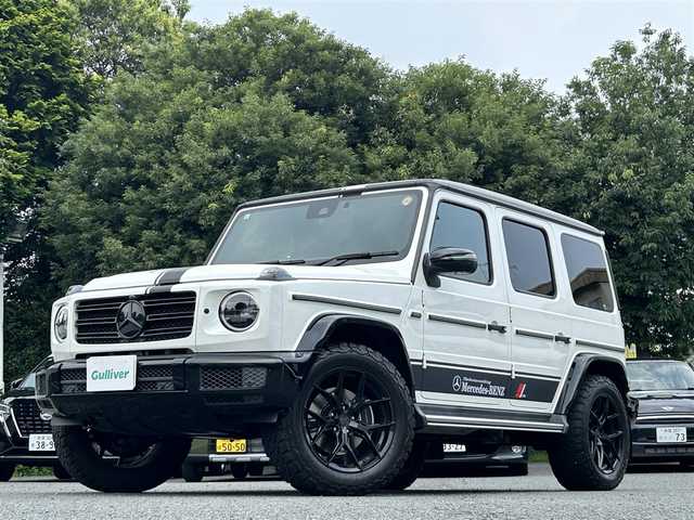 メルセデス・ベンツ ゲレンデヴァーゲン Ｇ４００ｄ マヌファクトゥーアエディション 東京都 2021(令3)年 6.1万km ダイヤモンドホワイト ワンオーナー/マヌファクトゥーアエディション/ガラススライディングルーフ/ブラックナッパ革シート/12.3インチワイドディスプレイナビ/・Burmesterサウンドシステム/・メルセデスミーコネクト/・フルセグTV/360°カメラ/レーダーセーフティパッケージ/・レーンアシスト/・ブレーキアシスト/・ブラインドスポットモニター/ブラックスモークマルチビームLEDヘッドランプ/大型オーバーフェンダー/ブラウンハイグロス木目調ステアリング/前席シートベンチレーション/シートヒーター/後席シートヒーター/社外アルミホイール20インチ（VOSSEN）/純正フロアマット/純正背面タイヤカバー車載/保証書/取扱説明書/スペアキー