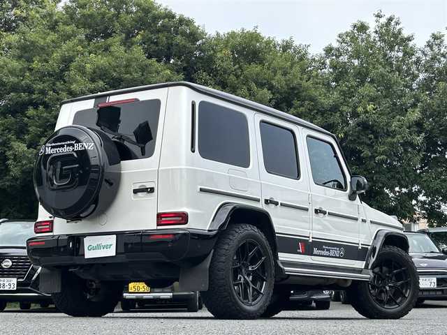 メルセデス・ベンツ ゲレンデヴァーゲン Ｇ４００ｄ マヌファクトゥーアエディション 東京都 2021(令3)年 6.1万km ダイヤモンドホワイト ワンオーナー/マヌファクトゥーアエディション/ガラススライディングルーフ/ブラックナッパ革シート/12.3インチワイドディスプレイナビ/・Burmesterサウンドシステム/・メルセデスミーコネクト/・フルセグTV/360°カメラ/レーダーセーフティパッケージ/・レーンアシスト/・ブレーキアシスト/・ブラインドスポットモニター/ブラックスモークマルチビームLEDヘッドランプ/大型オーバーフェンダー/ブラウンハイグロス木目調ステアリング/前席シートベンチレーション/シートヒーター/後席シートヒーター/社外アルミホイール20インチ（VOSSEN）/純正フロアマット/純正背面タイヤカバー車載/保証書/取扱説明書/スペアキー