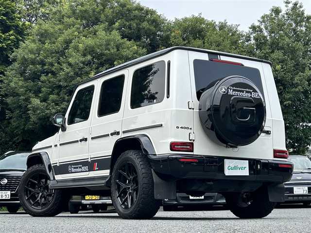 メルセデス・ベンツ ゲレンデヴァーゲン Ｇ４００ｄ マヌファクトゥーアエディション 東京都 2021(令3)年 6.1万km ダイヤモンドホワイト ワンオーナー/マヌファクトゥーアエディション/ガラススライディングルーフ/ブラックナッパ革シート/12.3インチワイドディスプレイナビ/・Burmesterサウンドシステム/・メルセデスミーコネクト/・フルセグTV/360°カメラ/レーダーセーフティパッケージ/・レーンアシスト/・ブレーキアシスト/・ブラインドスポットモニター/ブラックスモークマルチビームLEDヘッドランプ/大型オーバーフェンダー/ブラウンハイグロス木目調ステアリング/前席シートベンチレーション/シートヒーター/後席シートヒーター/社外アルミホイール20インチ（VOSSEN）/純正フロアマット/純正背面タイヤカバー車載/保証書/取扱説明書/スペアキー