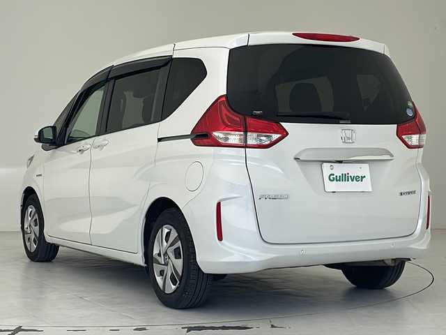 ホンダ フリード ハイブリット G ホンダセンシング 沖縄県 2021(令3)年 8.5万km プラチナホワイトパール 純正メモリナビ/　DTV/CD/DVD/USB/Bluetooth/バックカメラ/ビルトインETC/前後ドライブレコーダー/両側パワースライドドア/ホンダセンシング/レーダークルーズ/前席シートヒーター/アイドリングストップ/LEDヘッドライト/オートライト/純正フロアマット/プッシュスタート/スマートキ―