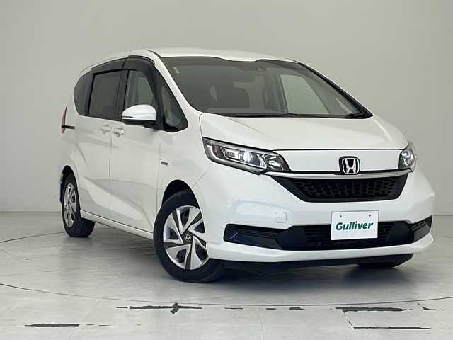 ホンダ フリード ハイブリット G ホンダセンシング 沖縄県 2021(令3)年 8.5万km プラチナホワイトパール 純正メモリナビ/　DTV/CD/DVD/USB/Bluetooth/バックカメラ/ビルトインETC/前後ドライブレコーダー/両側パワースライドドア/ホンダセンシング/レーダークルーズ/前席シートヒーター/アイドリングストップ/LEDヘッドライト/オートライト/純正フロアマット/プッシュスタート/スマートキ―