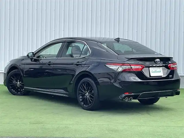 トヨタ カムリ WS ブラックエディション 香川県 2020(令2)年 5.1万km プレシャスブラックパール 純正ディスプレイオーディオ/（Bluetooth/USB）/前後ドライブレコーダー/バックカメラ/トヨタセーフティセンス/・プリクラッシュセーフティ/・アダプティブクルーズコントロール/・オートマチックハイビーム/・リアトラフィックアラート/・パーキングサポートブレーキ/・レーンディパーチャーアラート/ブラインドスポットモニター/クリアランスソナー/黒革シート/前席シートヒーター/革巻きステアリング/ステアリングスイッチ/パドルシフト/電動パーキングブレーキ/オートブレーキホールド/オートライト/LEDヘッドライト/LEDフォグライト/純正ビルトインETC/純正18インチアルミホイール/純正フロアマット/純正ドアバイザー/オート開閉機能付き電動格納ミラー/全席フルオートパワーウィンドウ/ISOFIX