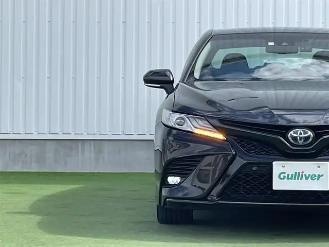 トヨタ カムリ WS ブラックエディション 香川県 2020(令2)年 5.1万km プレシャスブラックパール 純正ディスプレイオーディオ/（Bluetooth/USB）/前後ドライブレコーダー/バックカメラ/トヨタセーフティセンス/・プリクラッシュセーフティ/・アダプティブクルーズコントロール/・オートマチックハイビーム/・リアトラフィックアラート/・パーキングサポートブレーキ/・レーンディパーチャーアラート/ブラインドスポットモニター/クリアランスソナー/黒革シート/前席シートヒーター/革巻きステアリング/ステアリングスイッチ/パドルシフト/電動パーキングブレーキ/オートブレーキホールド/オートライト/LEDヘッドライト/LEDフォグライト/純正ビルトインETC/純正18インチアルミホイール/純正フロアマット/純正ドアバイザー/オート開閉機能付き電動格納ミラー/全席フルオートパワーウィンドウ/ISOFIX