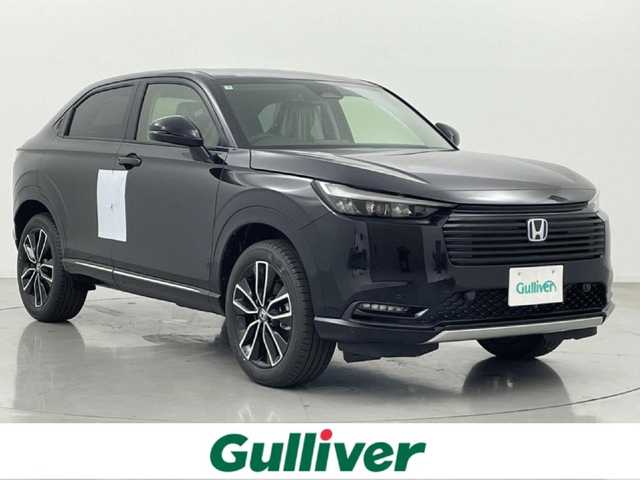 ホンダ ヴェゼル ハイブリッド e:HEV Z 熊本県 2025(令7)年 0.1千km クリスタルブラックパール 登録済未使用車　/純正ナビ（ＡｐｐｌＣａｒＰｌａｙ・ＡｎｄｒｏｉｄＡｕｔｏ・フルセグ・ＢＴ・ＵＳＢ）/バックカメラ　/ビルトインETC2.0/前席シートヒーター　/前後クリアランスソナー　/アイドリングストップ　/横滑り防止/ダウンヒルアシスト/ホンダセンシング/・衝突軽減ブレーキ/・誤発進抑制機能/・後方誤発進抑制機能/・近距離衝突軽減ブレーキ/・歩行者事故低減ステアリング/・路外逸脱制御機能/・アダブティブクルーズコントロール/・渋滞運転支援機能/・先行車発進お知らせ/・標識認識システム/・ブラインドスポットモニター/・車線維持支援システム/・オートハイビーム/パワーバックドア/ステアリングヒーター/置くだけ充電/ハーフレザーシート/純正１８インチAW/オートライト/LEDヘッドライト/スマートキー/プッシュスタート/スペアキー1本/保証書/取扱説明書
