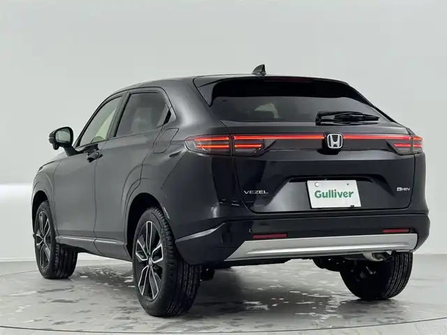 ホンダ ヴェゼル ハイブリッド e:HEV Z 熊本県 2025(令7)年 0.1千km クリスタルブラックパール 登録済未使用車　/純正ナビ/・Apple Car Play/AndroidAuto/フルセグTV/BT/USB/・バックカメラ/ホンダセンシング/・衝突軽減ブレーキ/・誤発進抑制機能/・後方誤発進抑制機能/・近距離衝突軽減ブレーキ/・歩行者事故低減ステアリング/・路外逸脱制御機能/・アダブティブクルーズコントロール/・渋滞運転支援機能/・先行車発進お知らせ/・標識認識システム/・ブラインドスポットモニター/・車線維持支援システム/・オートハイビーム/コーナーセンサー/ビルトインETC2.0/ハーフレザーシート/・D/Nシートヒーター　　/ダウンヒルアシスト/パワーバックドア/ステアリングヒーター/置くだけ充電/純正１８インチAW/オートライト/LEDヘッドライト/スマートキー/プッシュスタート/スペアキー1本/保証書/取扱説明書