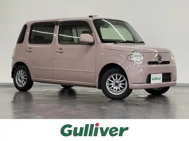 ダイハツ ミラ ココア L 三重県 2012(平24)年 12.1万km ムースピンクパール ガソリン/FF/インパネCVT/カロッツェリア『楽ナビ』（7インチ） AVIC-ZH77/（CD/DVD/MSV/FM/AM/TV/SD/Bluetooth/iPod/USB/AUX）/ETC/安全装備/・ABS（EBD機能付）/・ヒルスタートシステム（坂道発進アシスト）/・デュアルSRSエアバッグ（運転席・助手席）/・衝突安全ボディ『TAF』/装備/・キーレスエントリー/・マニュアルエアコン/・セキュリティアラーム/・電動格納ドアミラー/・13インチアルミホイール＋冬タイヤ/・純正ホイールキャップ＆夏タイヤあり