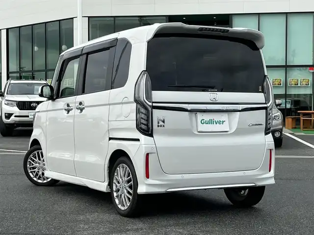ホンダ Ｎ ＢＯＸ カスタム L ターボ 奈良県 2021(令3)年 1.3万km プラチナホワイトパール 純正ナビ（VXU-217NBi)/（フルセグ／ＢＴ／ＣＤ／ＤＶＤ）/レーダークルーズコントロール/バックカメラ/前後コーナーセンサー/衝突軽減システム/レーンキープアシスト/両側パワースライドドア/ハーフレザーシート/前席シートヒーター/後席サンシェード/前後ドライブレコーダー/ETC/純正15インチAW/保証書/取り扱い説明書/スペアキーX1