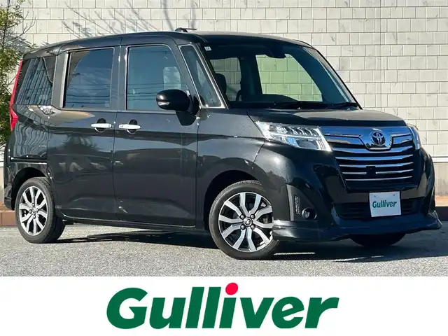 トヨタ ルーミー カスタムG－T 滋賀県 2017(平29)年 6.6万km ブラックマイカメタリック 両側パワースライドドア/社外7インチナビ【CN-RX04WD】/(AM/FM/CD/DVD/Blu-ray/フルセグ/Bluetooth)/バックカメラ/ETC/トヨタセーフティセンス/・踏み間違い防止アシスト/・ブレーキアシスト/・プリクラッシュブレーキアシスト/・ヒルスタート（坂道発進）アシスト/・後側方衝突防止支援システム/・TCS（トラクションコントロールシステム）/・VDC（ビークルダイナミクスコントロール）/・レーンキープアシスト/・ASCD（オートスピードコントロール装置）/・ABS（アンチロックブレーキシステム）/・バックビューモニター/電動格納ミラー/ステアリングスイッチ/オートライト/LEDヘッドライト/フロントフォグ/フルオートエアコン/プッシュスタート/スマートキー/純正フロアマット