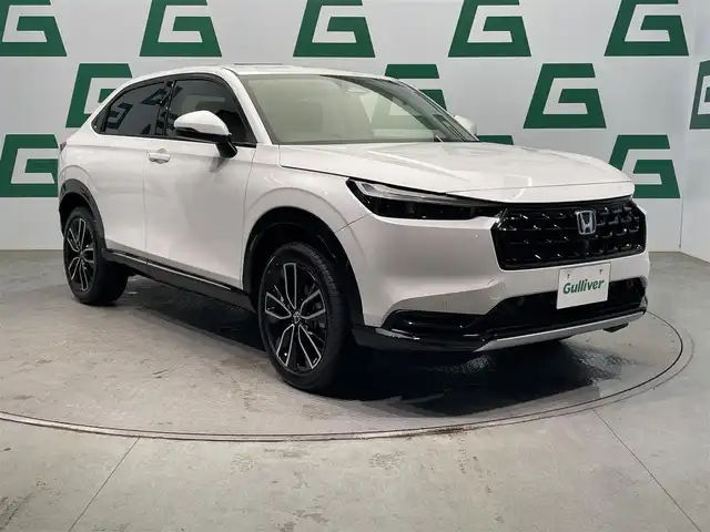 ホンダ ヴェゼル ハイブリッド e:HEV Z 鹿児島県 2025(令7)年 0.1万km未満 プラチナホワイトパール Honda CONNECTディスプレー+ETC2.0車載器+ワイヤレス充電器/純正フロントグリル（ベルリナブラック）/ホンダセンシング　/バックカメラ/ブラインドスポットモニター　/電動パーキングブレーキ　/オートブレーキホールド　/オールオートウィンドウ　/革巻きステアリング/ステアリングヒーター/パドルシフト