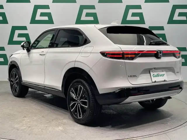 ホンダ ヴェゼル ハイブリッド e:HEV Z 鹿児島県 2025(令7)年 0.1万km未満 プラチナホワイトパール Honda CONNECTディスプレー+ETC2.0車載器+ワイヤレス充電器/純正フロントグリル（ベルリナブラック）/ホンダセンシング　/バックカメラ/ブラインドスポットモニター　/電動パーキングブレーキ　/オートブレーキホールド　/オールオートウィンドウ　/革巻きステアリング/ステアリングヒーター/パドルシフト