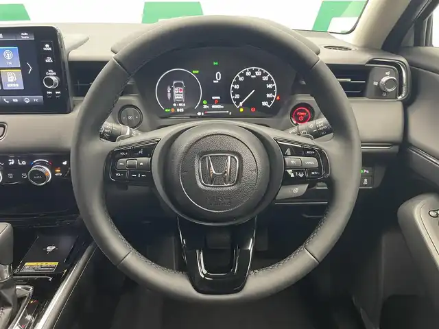ホンダ ヴェゼル ハイブリッド e:HEV Z 鹿児島県 2025(令7)年 0.1万km未満 プラチナホワイトパール Honda CONNECTディスプレー+ETC2.0車載器+ワイヤレス充電器/純正フロントグリル（ベルリナブラック）/ホンダセンシング　/バックカメラ/ブラインドスポットモニター　/電動パーキングブレーキ　/オートブレーキホールド　/オールオートウィンドウ　/革巻きステアリング/ステアリングヒーター/パドルシフト