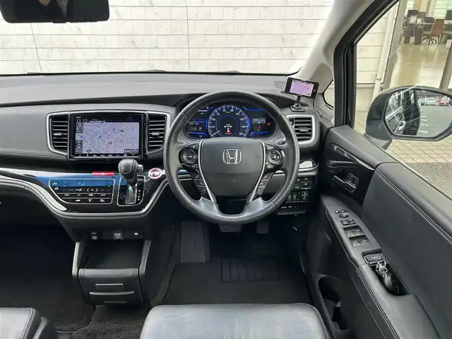 ホンダ オデッセイ ハイブリッド アブソルート・EXホンダセンジング 埼玉県 2019(平31)年 9.9万km クリスタルブラックパール ホンダ純正ナビオーディオ/（AM/FM/フルセグTV/BT/CD/DVD/SD）/フルセグTV/全方位カメラ/ホンダセンシング/・アダプティブクルーズコントロール/・LKAS/・先行車発信お知らせ機能/・標識自動認識機能/リモコンエンジンスターター/電子制御パーキングブレーキ/ブレーキホールド/ホンダ純正フリップダウンモニター/ビルトインETC2.0/ホンダ純正アドバンスドルームミラー/ホンダ純正ナビ連動前方ドラレコ/ホンダ純正後方単独ドラレコ/アイドリングストップ/コーナーセンサー前後/オートライト/ダブルエアコン/プッシュスタートボタン/スマートキー×2/ステアリングスイッチ/純正フロアマット/USBチャージャー/サイドステップガーニッシュ（LEDイルミ付）/テールゲートストラップ/車両/ナビ 取扱説明書/保証書