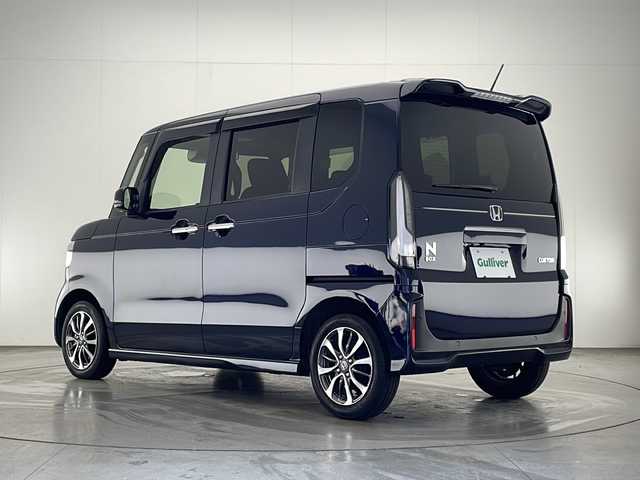 ホンダ Ｎ ＢＯＸ カスタム 宮崎県 2023(令5)年 0.5万km ミッドナイトブルービームM 禁煙車/ホンダセンシング/純正LEDオートライト/純正エアロ/純正ルーフエンドスポイラー/純正14インチアルミ/純正フロアマット/両側電動スライドドア/アダプティブクルーズコントロール/レーンディパーチャーアラート/電子パーキング/ブレーキホールド/クリアランスソナー/ウインカードアミラー/オートエアコン/前席シートヒーター/リアプライバシーガラス/ドアバイザー/スマートキー/プッシュエンジンスタート/スペアキー/新車時保証書/取扱い説明書