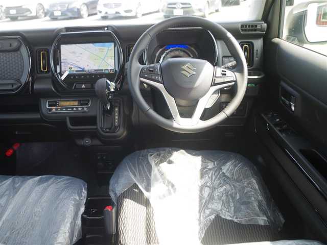 スズキ ハスラー HYBRID X 千葉県 2025(令7)年 0.1万km未満 ソフトベージュメタリック HV　X　全方位モニター付きナビゲーション＆スズキセーフティサポート(217800円)/デュアルカメラブレーキサポート/レーダークルーズコントロール/アイドリングストップ/前席シートヒーター/純正メモリーナビ/地デジTV/【DVD/CD再生機能　Bluetooth接続】/全方位モニター/革巻きステアリング/前席シートヒーター/LEDヘッドライト/フォグライト/ウインカーミラー/リアコーナーセンサー/純正15インチアルミホイル/サイド/カーテンエアバッグ/携帯リモコン