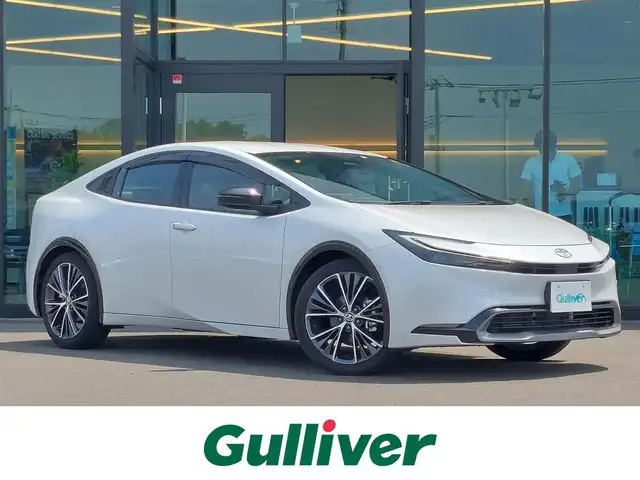 トヨタ プリウス Z 東京都 2023(令5)年 0.4万km プラチナホワイトパールマイカ 純正12.3インチディスプレイオーディオ/パノラミックビューモニター/ビルトインETC2.0/ドライブレコーダー/AC100V/ステアリングヒーター/シートヒーター/ベンチレーションシート/パワーシート/パワーバックドア/トヨタチームメイト/トヨタセーフティセンス/・プリクラッシュセーフティ/・レーントレーシングアシスト/・レーンディパーチャーアラート/・レーダークルーズコントロール/・アダプティブハイビームシステム/・オートマチックハイビーム/・ブラインドスポットモニター/・パーキングサポートブレーキ