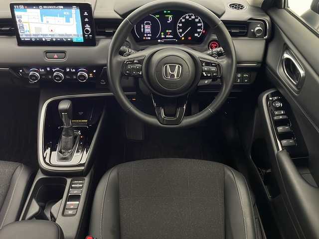 ホンダ ヴェゼル ハイブリッド e:HEV Z 宮崎県 2021(令3)年 1.4万km メテオロイドグレーメタリック 禁煙車/ホンダセンシング/純正9型ディスプレイオーディオナビTV/（HONDA CONNECT/Bluetooth/FMAM/フルセグTV)/純正バックカメラ/純正ビルトイン2.0ETC/純正LEDオートライト/純正LEDフォグ/純正18インチアルミ/純正フロアマット/アダプティブクルーズコントロール/レーンディパーチャーアラート/クリアランスソナー/ブラインドスポットモニター/パワーバックドア/パドルシフト/ハーフレザーシート/前席シートヒーター/置くだけ充電/デュアルオートエアコン/ステアリングヒーター/スマートキー/プッシュエンジンスタート/新車時保証書/取扱い説明書