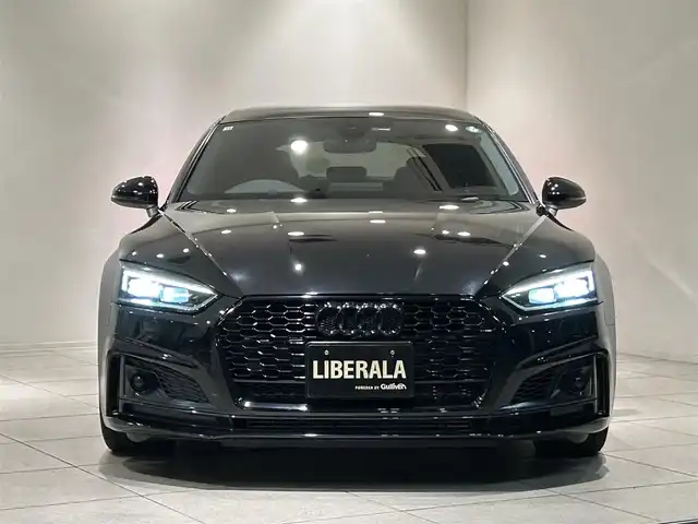アウディ Ｓ５ スポーツバック 愛知県 2018(平30)年 5.4万km 黒 ・ＫＷ車高調整サスペンション　/。マトリクスLEDヘッドライト/・LEDリヤコンビネーションライト/ダイナミックターンインジケーター/・ヘッドライトウォッシャー/・Sスポーツバンパー/・アルミホイール 5スポークSデザイン/コントラストグレーポリッシュト/8.5J×19+255/35 R19タイヤ/・トランクリッドオープナー/・エクステリアミラーハウジング/アルミニウム/・カラードブレーキキャリパーレッド/・スポーツシート赤レザー/・シートヒーター（フロント）/・デコラティブパネル／カーボンアトラス/・ステアリングホイール 3スポークレザー　/マルチファンクション フラットボトム/・Sステアリングホイールエンブレム/・ドアシルトリム S ロゴ/・アウディサイドアシスト/・アダプティブクルーズコントロール/・アウディアクティブレーンアシスト/・リヤビューカメラ/・アウディパーキングシステム/・アウディホールドアシスト/・アウディプレセンス シティ/・アウディドライブセレクト/・ MMI ナビゲーション/・ Audi connect ／セーフティ＆サービス／/Audi connect Navigator/・スマートフォンインターフェイス