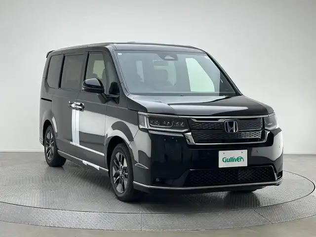 ホンダ ステップワゴン スパーダ eHEV 兵庫県 2025(令7)年 0.1万km未満 クリスタルブラックパール 登録済未使用車/純正メモリナビ(CD/DVD/SD/Bluetooth/フルセグ)/・LXM-247VFi/バックカメラ/前後コーナーセンサー/両側パワースライドドア/パワーバックドア/ハーフレザーシート/シートヒーター/追従型クルーズコントロール/スマートキー/スペアキー/純正16インチアルミホイール/レーンキープアシスト/オートライト/LEDヘッドライト/LEDフォグライト/ヘッドライトレベライザー/ブラインドスポットモニター
